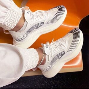 White and Blue Sneakers with Breathable Mesh and Curved Sole